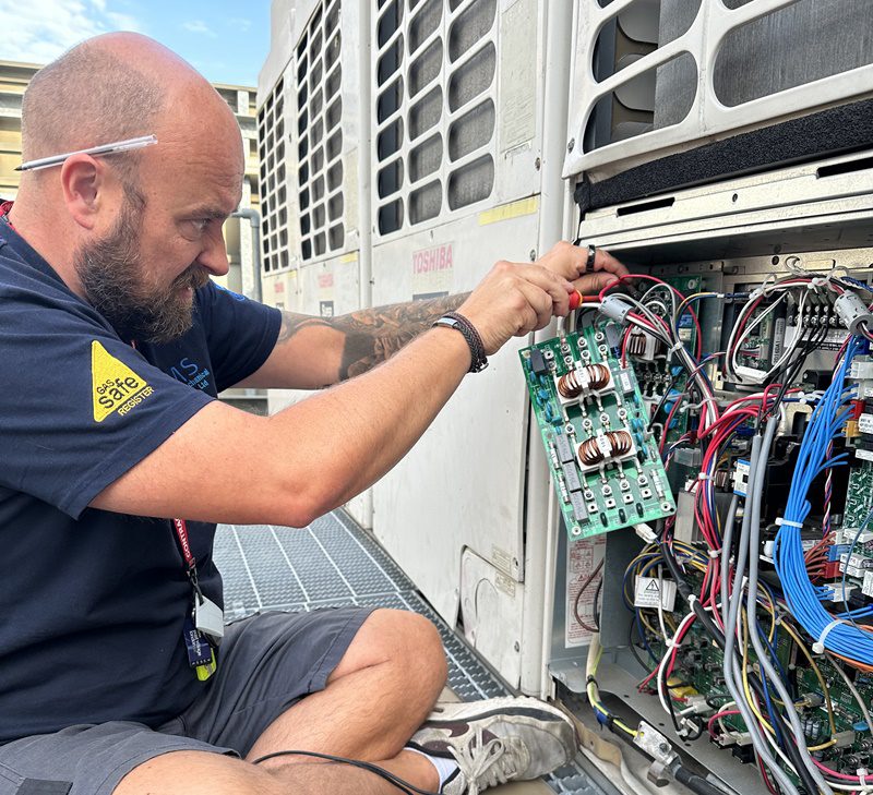 Air Conditioning Unit being services by Kendall Mechanical Services